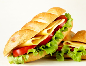 Fresh sandwich with vegetables, green salad and cheese