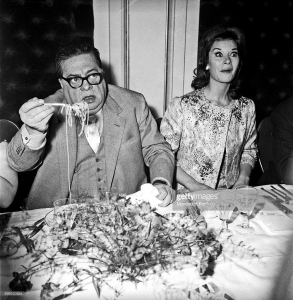 Italian actor Aldo Fabrizi eating spaghetti in a restaurant. Rome, 1960