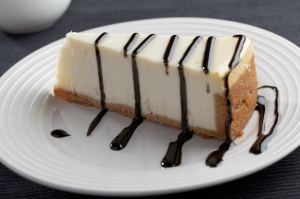 Slice of cheesecake with liquorice sauce